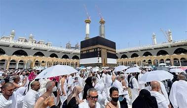Umrah Transport Services 2026 | Hajj & Umrah Travel Muslim pilgrims performing Tawaf around the sacred Kaaba in Mecca during Hajj